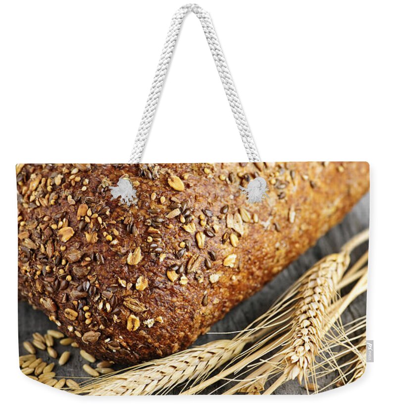Bread Weekender Tote Bag featuring the photograph Loaf of multigrain bread 2 by Elena Elisseeva