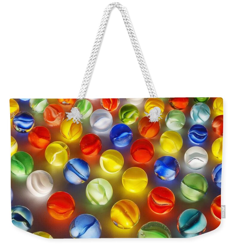Marbles Weekender Tote Bag featuring the photograph Marbles #1 by Jim Hughes