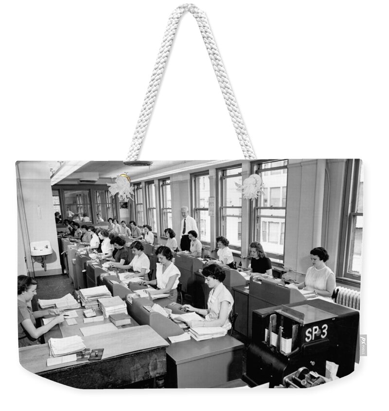 1035-287 Weekender Tote Bag featuring the photograph Office Workers Entering Data #2 by Underwood Archives