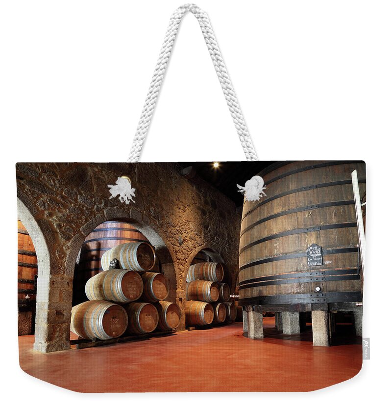Fermenting Weekender Tote Bag featuring the photograph Porto Wine Cellar #2 by Vuk8691