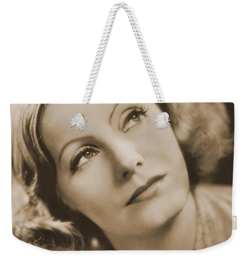 Entertainment Weekender Tote Bag featuring the photograph Greta Garbo, Hollywood Movie Star by Photo Researchers