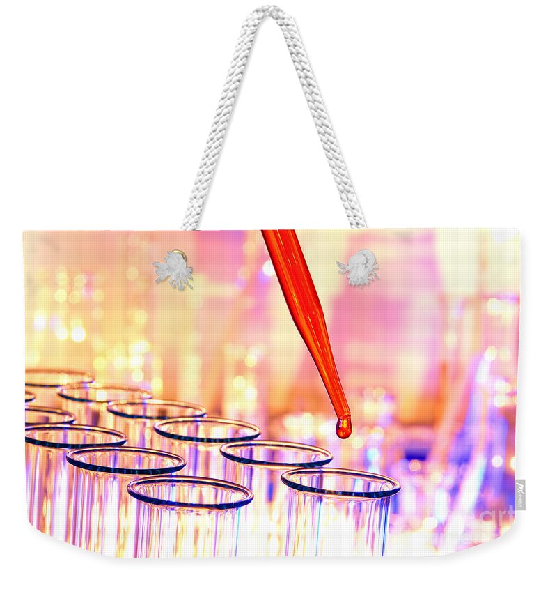 Test Weekender Tote Bag featuring the photograph Laboratory Experiment in Science Research Lab by Science Research Lab By Olivier Le Queinec