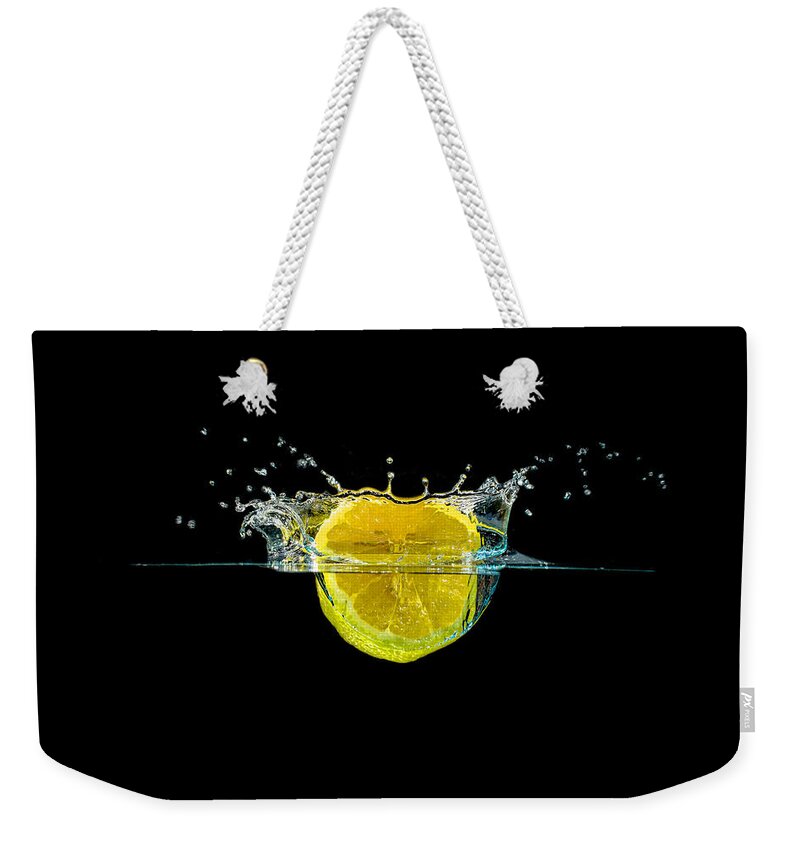 Beverage Weekender Tote Bag featuring the photograph Splashing Lemon #3 by Peter Lakomy