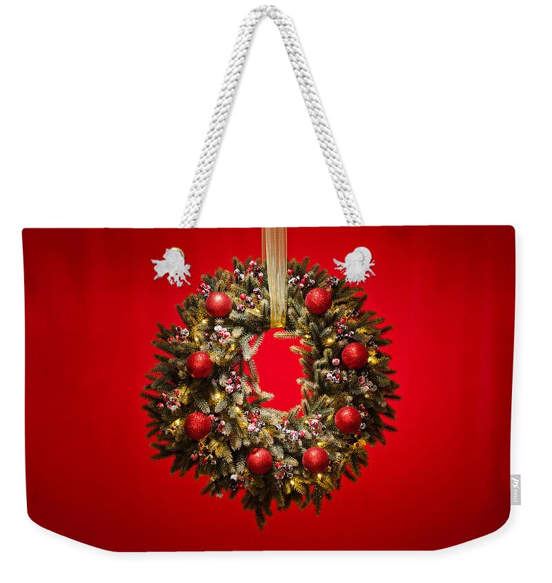 Advent Weekender Tote Bag featuring the photograph Advent wreath over red background #4 by U Schade