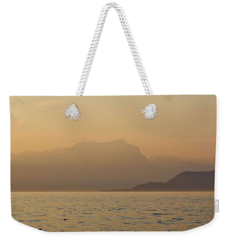 Francacorta Weekender Tote Bag featuring the photograph Lazise sunset. Lago di Garda #4 by Jouko Lehto