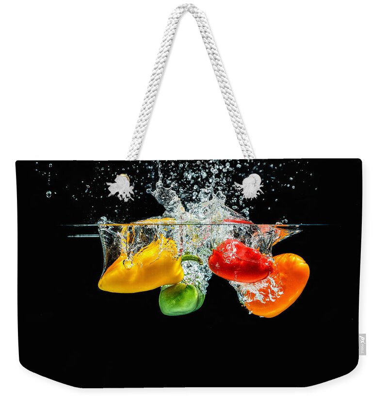 Agriculture Weekender Tote Bag featuring the photograph Splashing Paprika by Peter Lakomy
