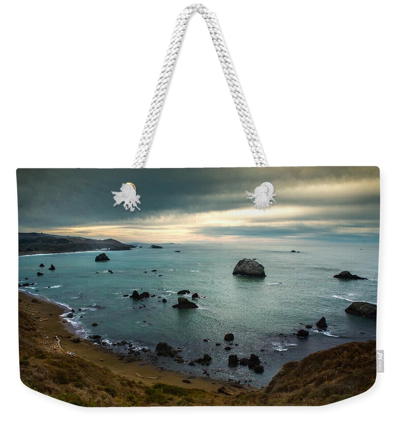 Ocean Weekender Tote Bag featuring the photograph A Dark Day at Sea by Bryant Coffey
