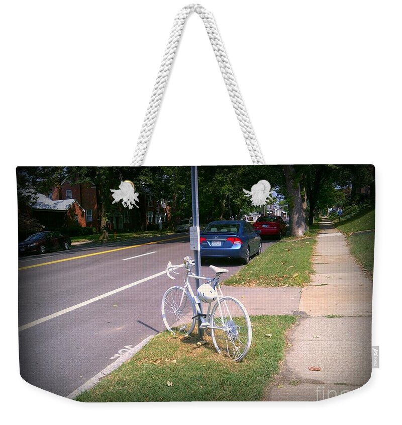  Weekender Tote Bag featuring the photograph A Fallen Cyclist by Kelly Awad