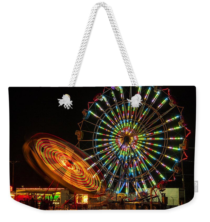 Colorful Carnival Ferris Wheel Ride At Night Prints Weekender Tote Bag featuring the photograph Colorful Carnival Ferris Wheel Ride at Night by Jerry Cowart
