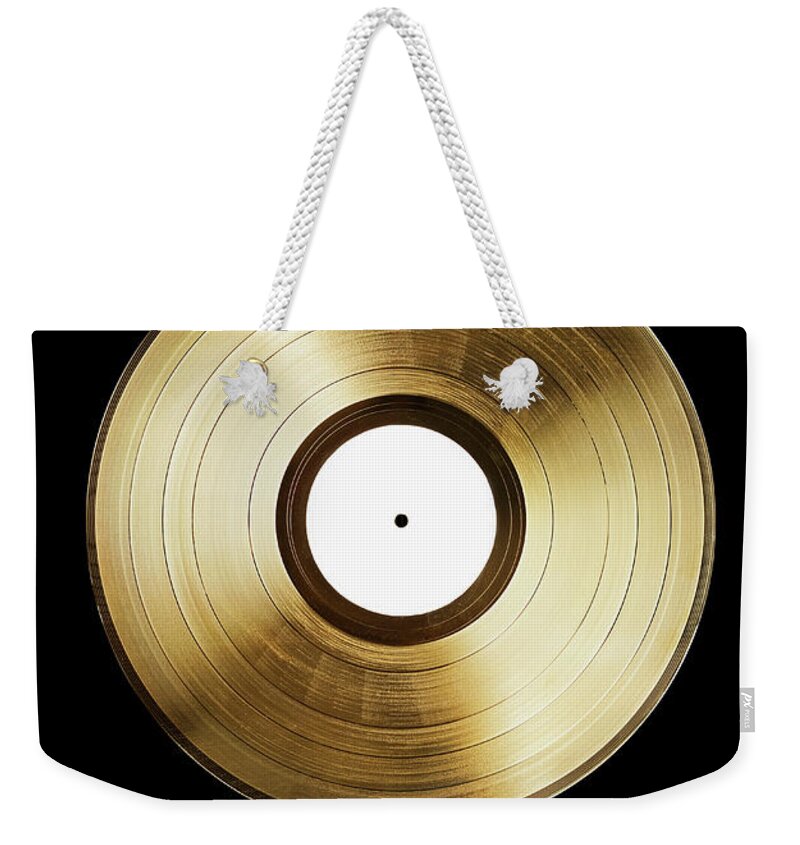 Simplicity Weekender Tote Bag featuring the photograph A Gold Record On A Black Background by Larry Washburn