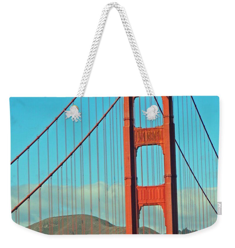 A Golden Gate View Weekender Tote Bag featuring the photograph A Golden Gate View by Emmy Vickers