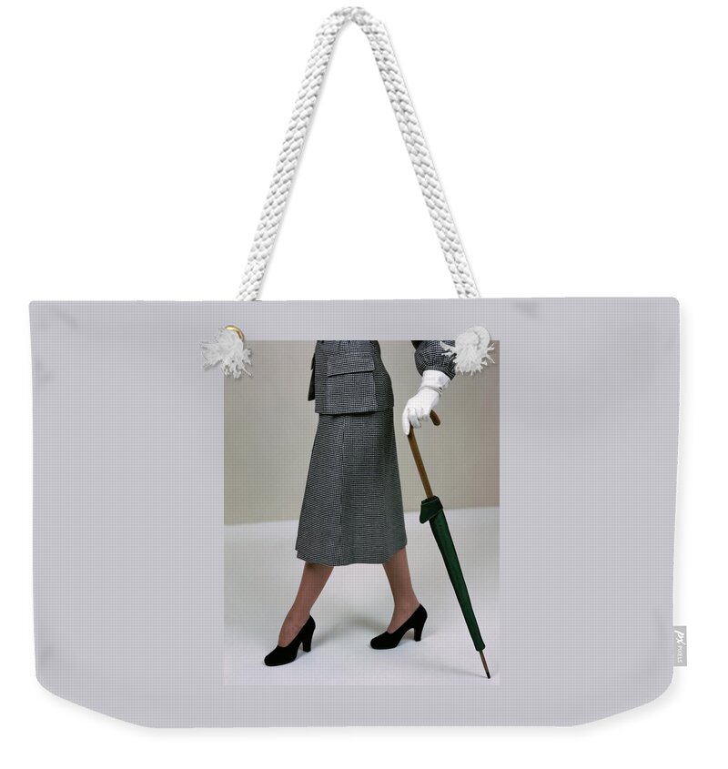 A Model Holding An Umbrella Weekender Tote Bag
