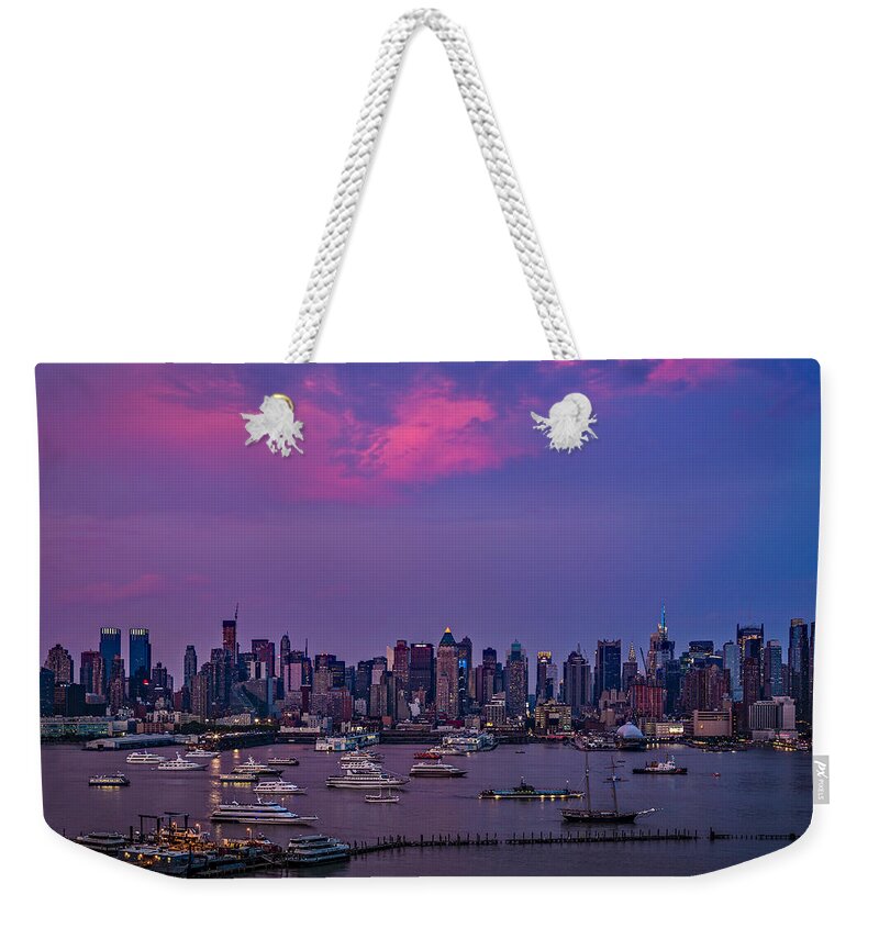 Manhattan Weekender Tote Bag featuring the photograph A Spectacular New York City evening by Susan Candelario