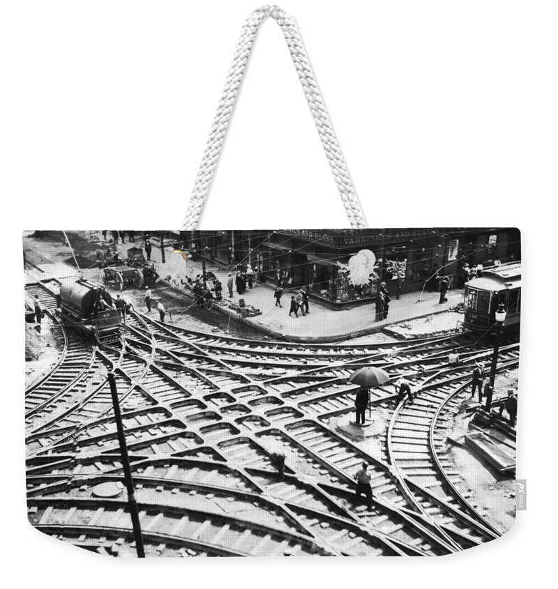1910s Weekender Tote Bag featuring the photograph A Streetcar Intersection by Underwood Archives
