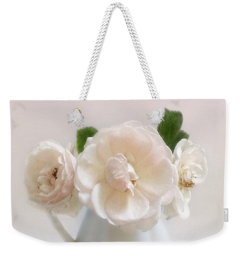 Rose Weekender Tote Bag featuring the photograph A Trio of Pale Pink Vintage Roses by Louise Kumpf