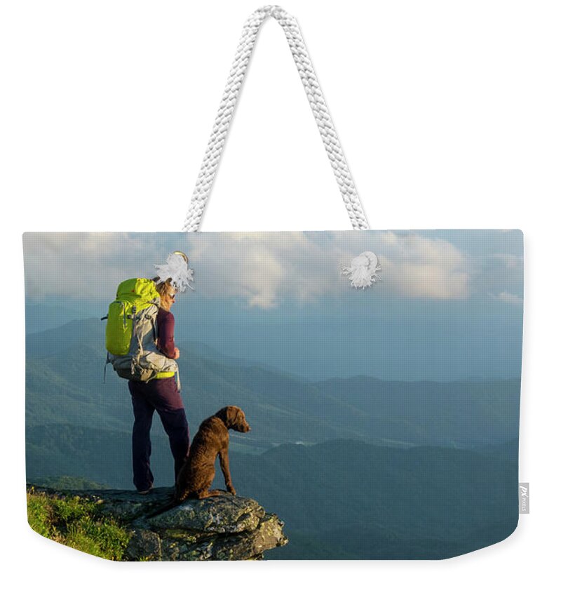 Women Weekender Tote Bag featuring the photograph A Woman Hiking On The Roan Highlands by Kennan Harvey
