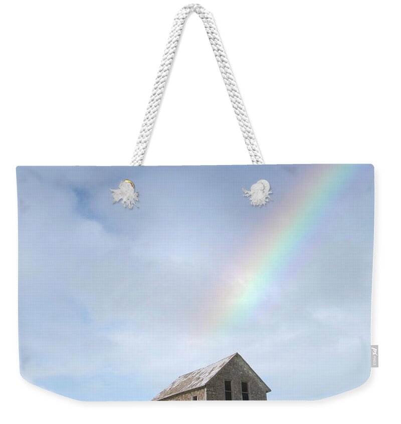 Scenics Weekender Tote Bag featuring the photograph Abandoned Farmhouse With A Rainbow by Grant Faint