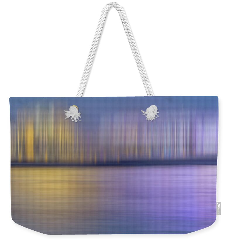 Abstract Weekender Tote Bag featuring the photograph Abstract Pattern Of Blurred Buildings by Ikon Ikon Images