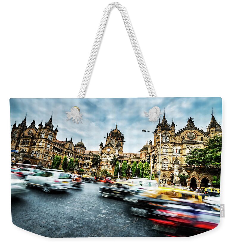 Blurred Motion Weekender Tote Bag featuring the photograph Active Victoria Rail Station In Mumbai by Extreme-photographer
