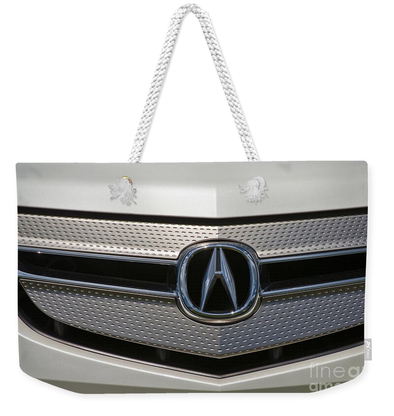 Acura Weekender Tote Bag featuring the photograph Acura Grill Emblem Close up by David Zanzinger