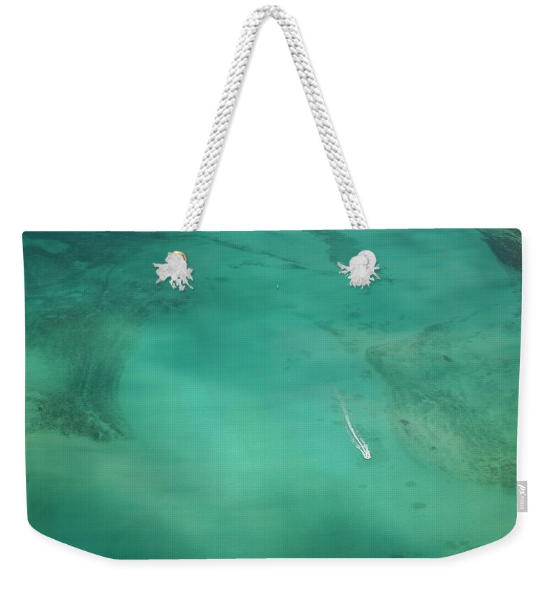 Tranquility Weekender Tote Bag featuring the photograph Aerial Of Turquoise Waters With Passing by Merten Snijders