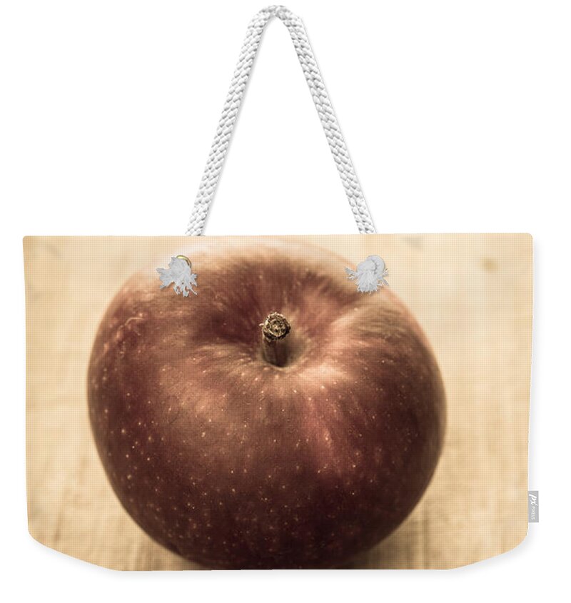 Aged Weekender Tote Bag featuring the photograph Aged Apple by Edward Fielding
