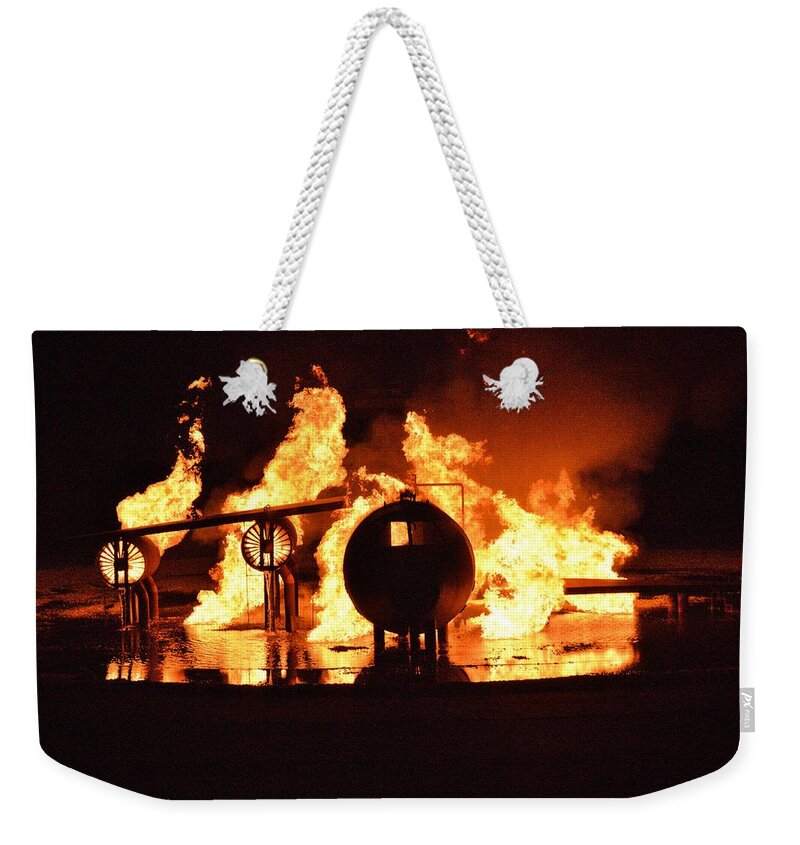Airplane Weekender Tote Bag featuring the photograph Airforce Fire Deparment Training by Aaron Martens
