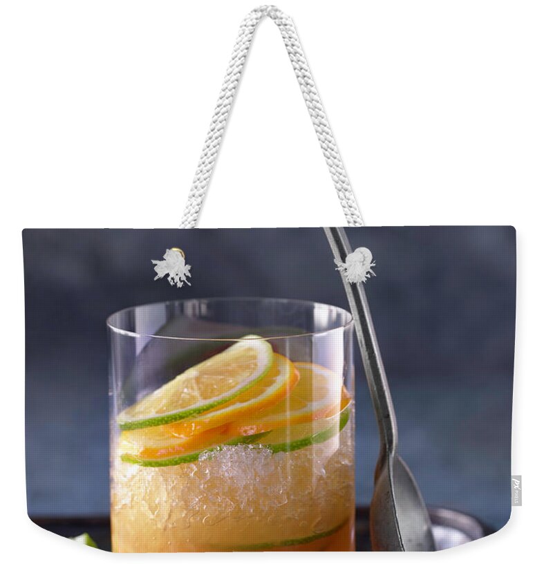 Orange Color Weekender Tote Bag featuring the photograph Alcohol Cocktails by Brian Macdonald