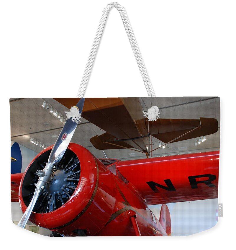 Amelia Earhart Weekender Tote Bag featuring the photograph Amelia Earhart Prop Plane by Kenny Glover