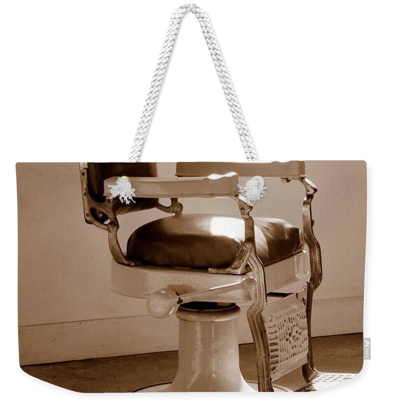 Sepia Weekender Tote Bag featuring the photograph Antiquated Barber Chair in Sepia by Mary Deal