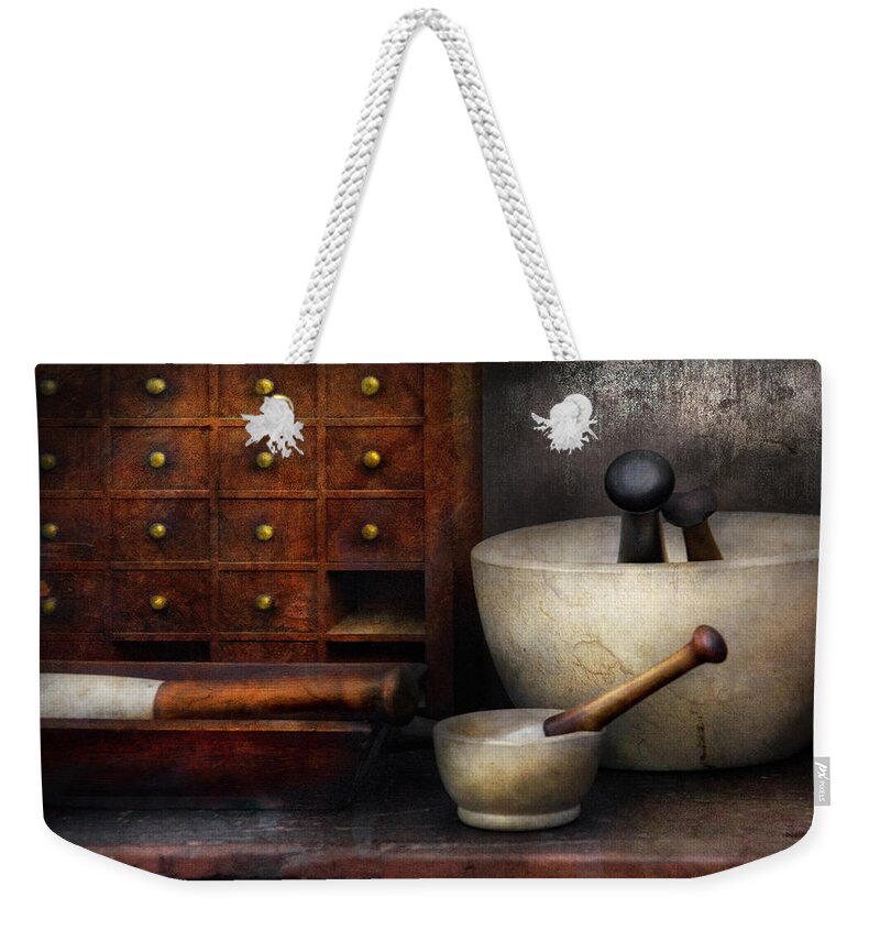 Suburbanscenes Weekender Tote Bag featuring the photograph Apothecary - Pestle and Drawers by Mike Savad