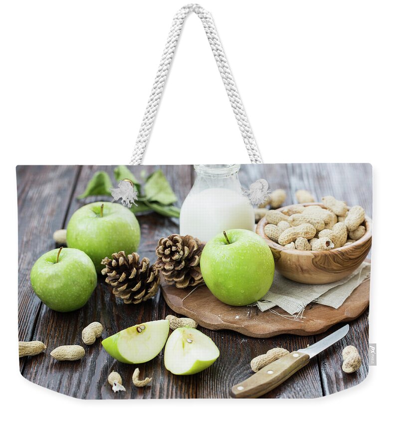 Breakfast Weekender Tote Bag featuring the photograph Apples And Peanuts For Breakfast by Julia Khusainova