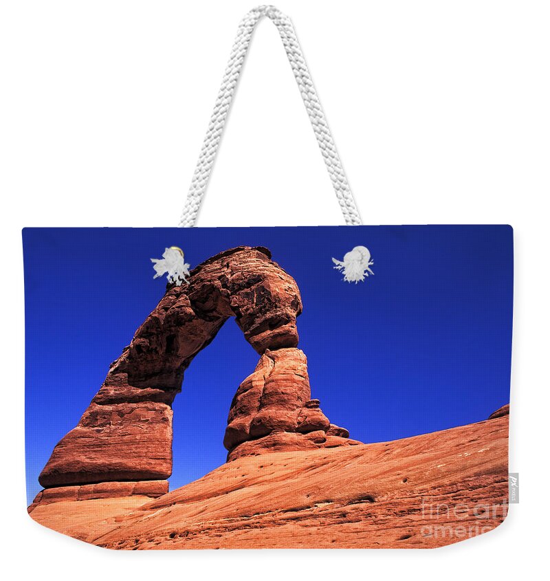 Natural Arch Weekender Tote Bag featuring the photograph Arches National Park in Utah by Bill Bachmann