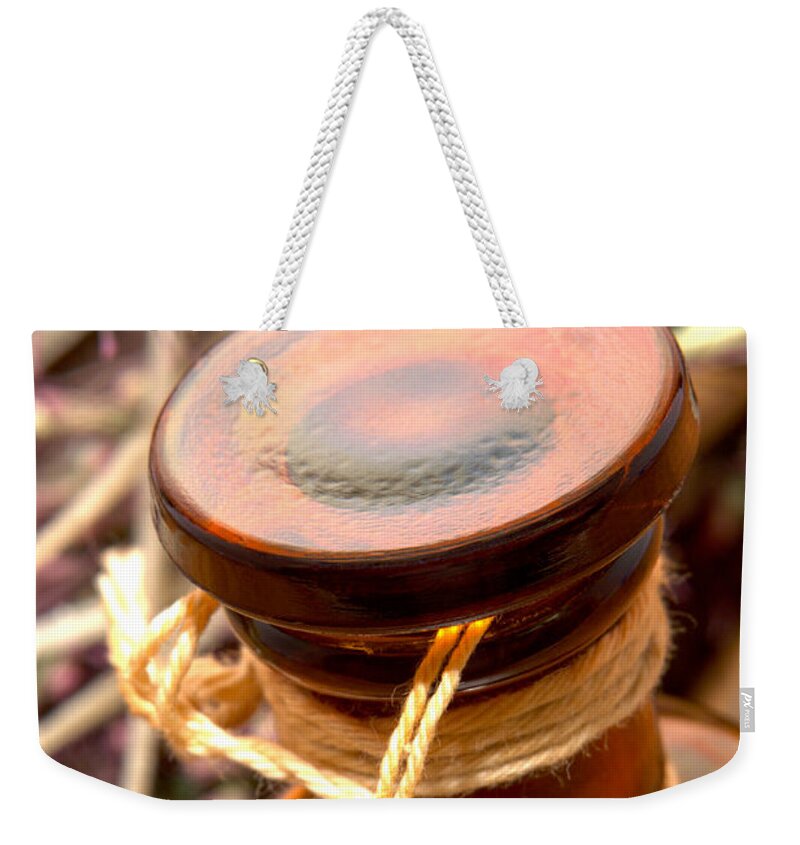 Aromatherapy Weekender Tote Bag featuring the photograph Aromatherapy Bottle by Olivier Le Queinec