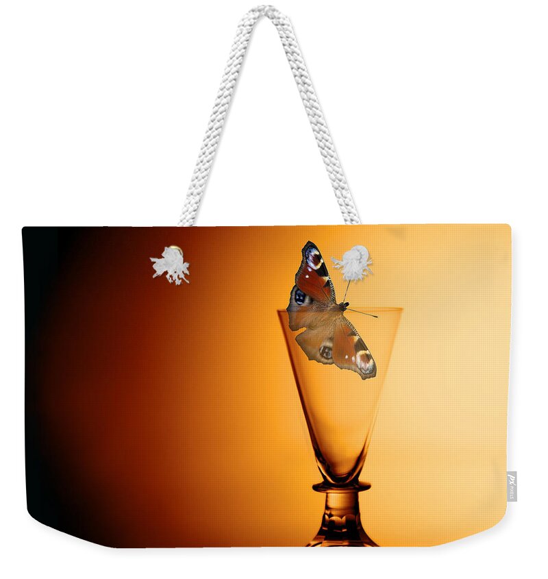 Peacock Butterfly Weekender Tote Bag featuring the photograph As light as a butterfly by Torbjorn Swenelius