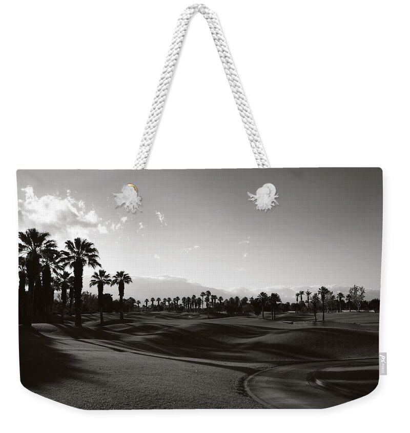 Palm Desert Weekender Tote Bag featuring the photograph As Shadows Spread Across the Land by Laurie Search