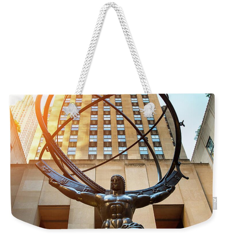 Globe Weekender Tote Bag featuring the photograph Atlas Sculpture At The Rockefeller by Sylvain Sonnet