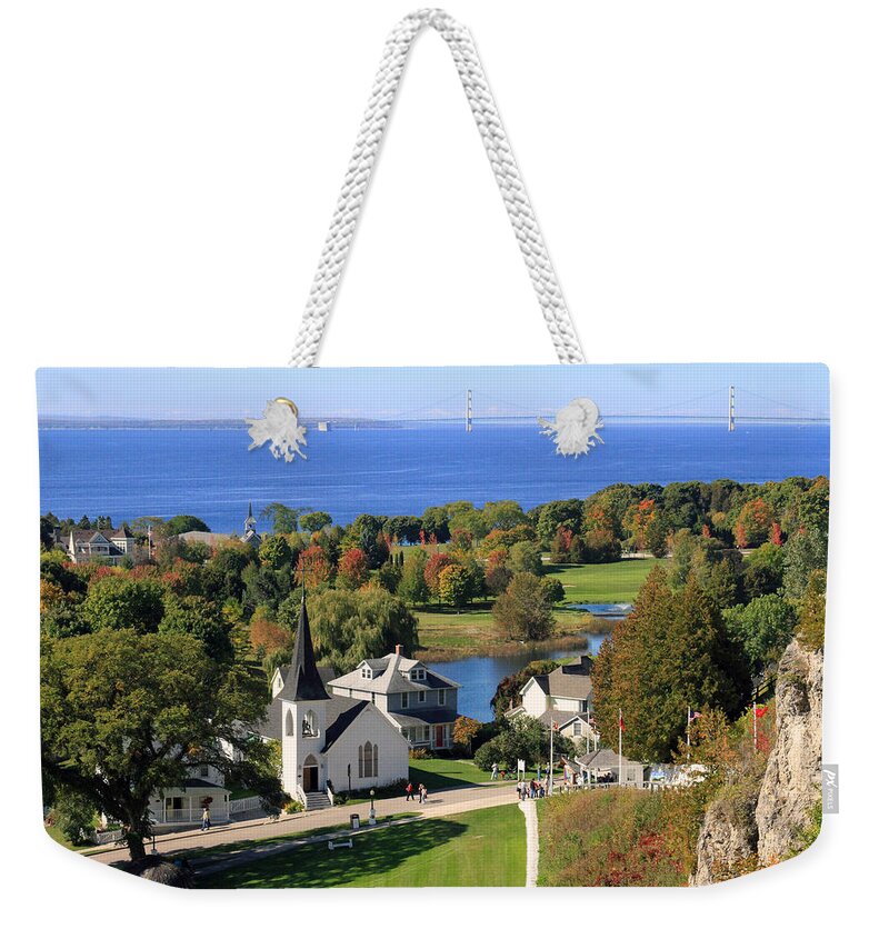 Mackinac Island Weekender Tote Bag featuring the photograph Autumn view on Mackinac Island by Jackson Pearson