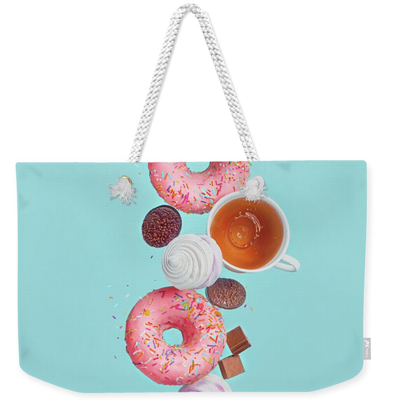 Levitation Weekender Tote Bag featuring the photograph Balancing Donuts by Dina Belenko Photography