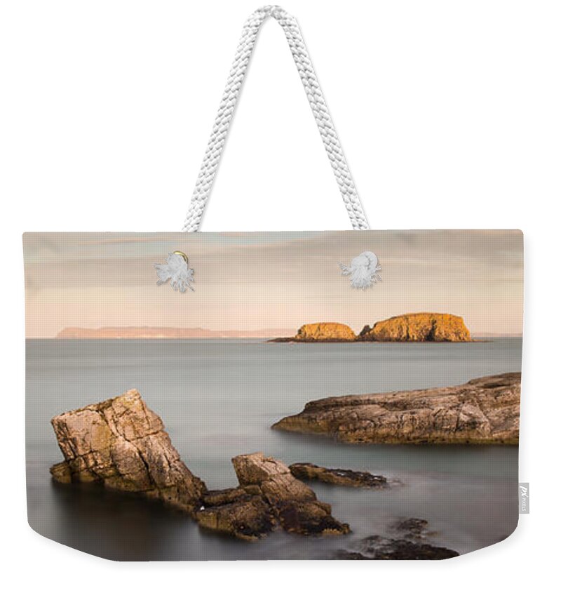 Sheep Island Weekender Tote Bag featuring the photograph Ballintoy Bay by Nigel R Bell