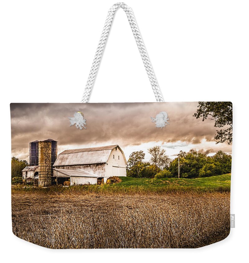 Barn Weekender Tote Bag featuring the photograph Barn Silos Storm Clouds by Ron Pate