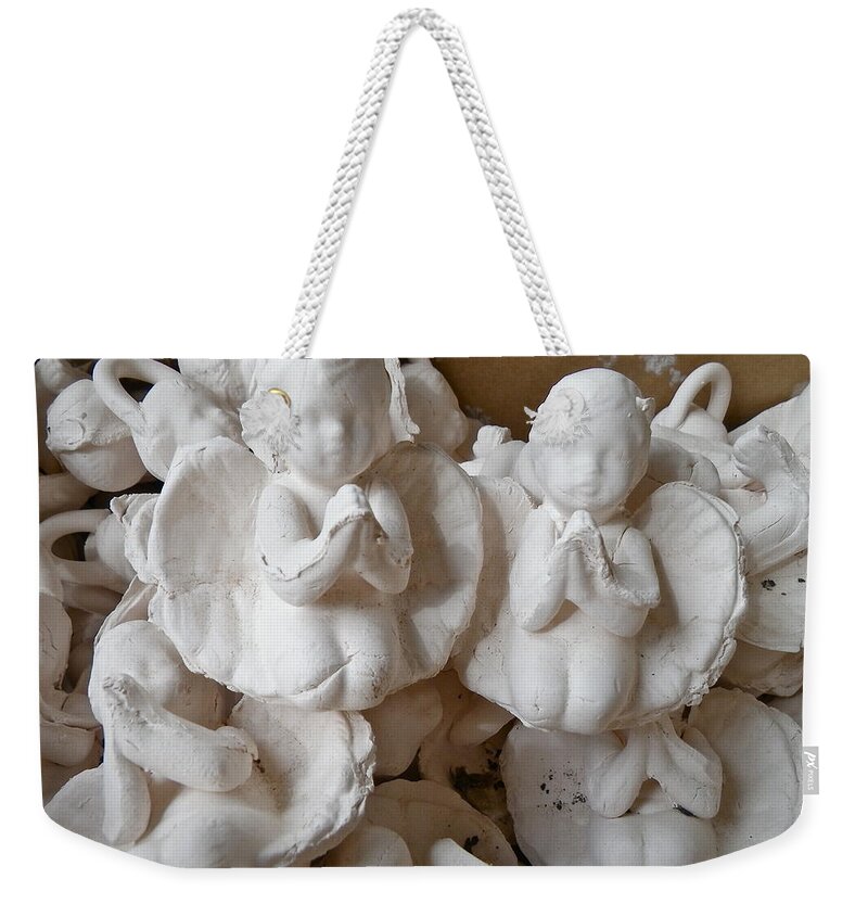 Clay Weekender Tote Bag featuring the pyrography Basket of Praying Angels by Anna Ruzsan