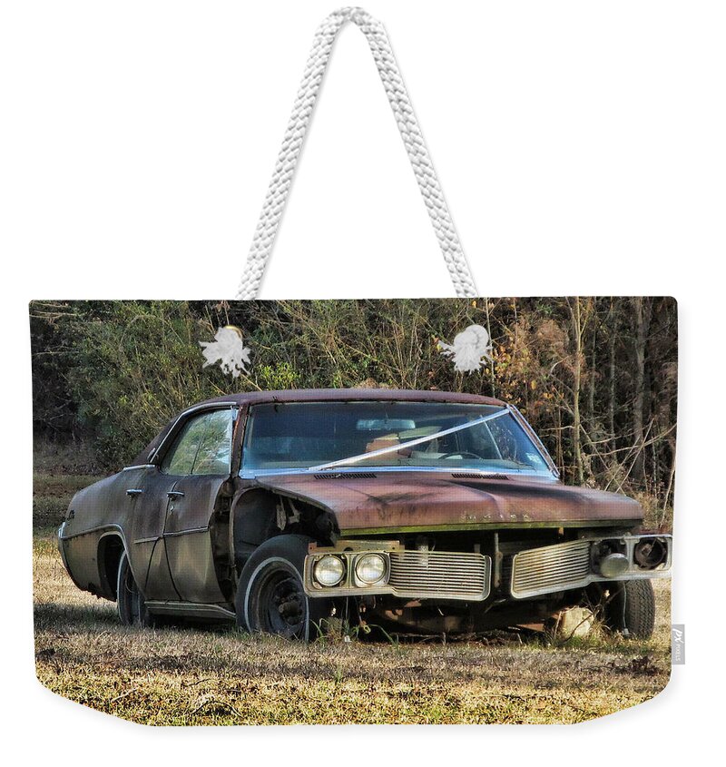 Victor Montgomery Weekender Tote Bag featuring the photograph Battered Buick by Vic Montgomery