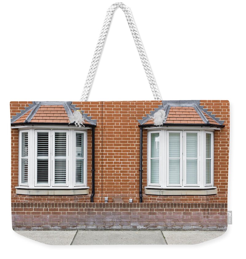 Adjacent Weekender Tote Bag featuring the photograph Bay windows by Tom Gowanlock