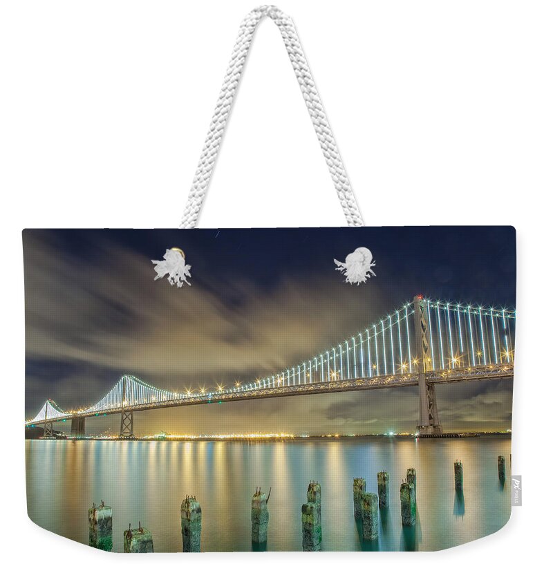 City Weekender Tote Bag featuring the photograph Beating The Odd by Jonathan Nguyen