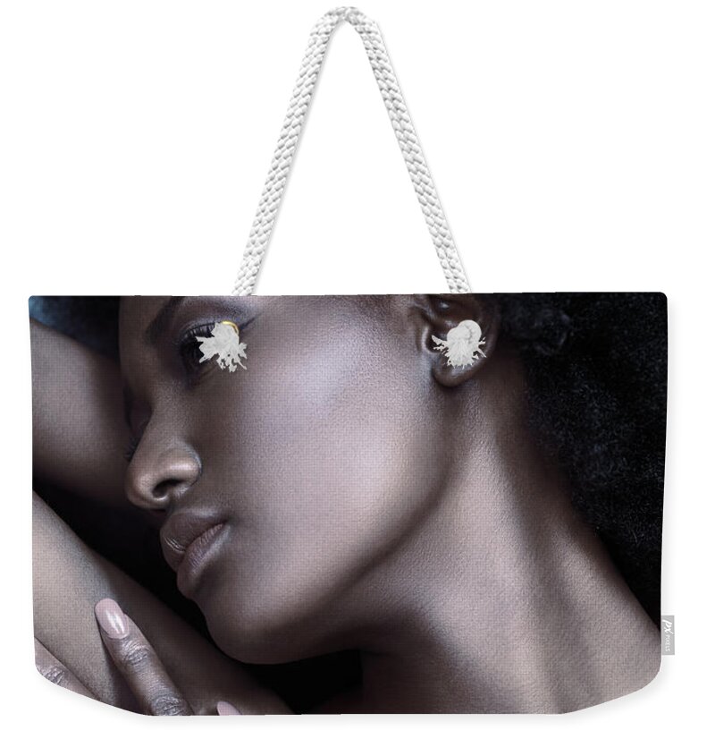 Beauty Weekender Tote Bag featuring the photograph Beautiful black woman face with shiny silver skin by Maxim Images Exquisite Prints