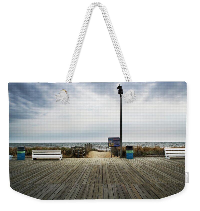 Absence Weekender Tote Bag featuring the photograph Benches On Boardwalk Rehoboth Beach by Yvonne Boyd