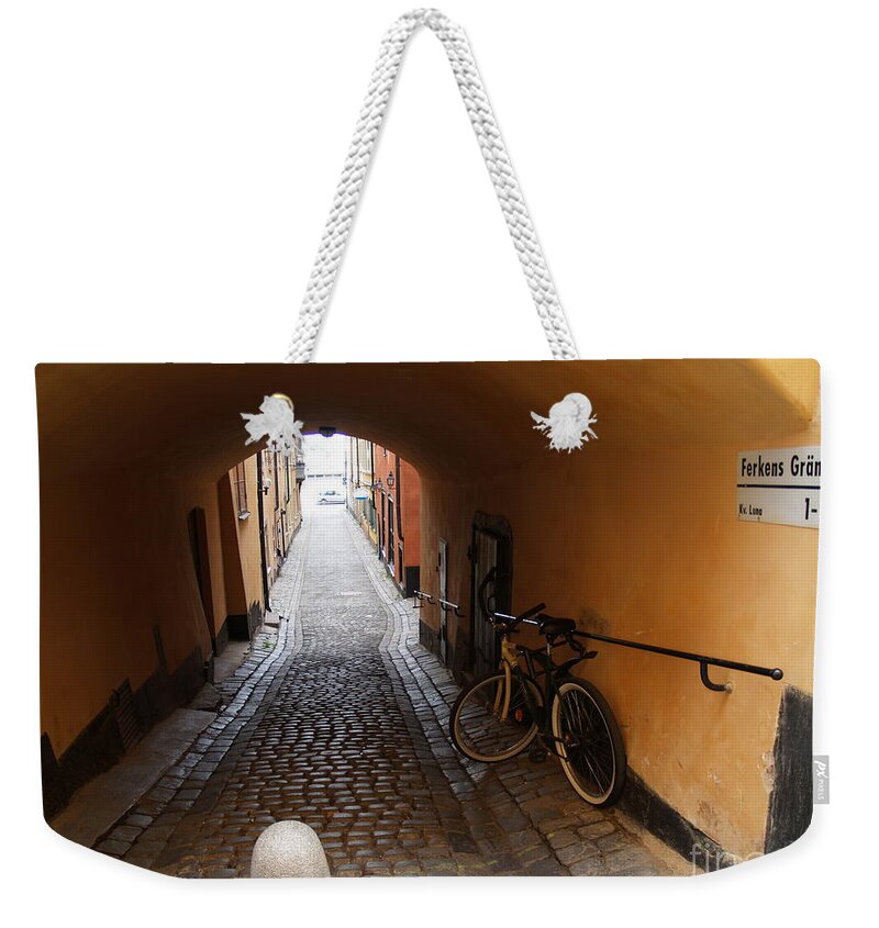 Bicycle Weekender Tote Bag featuring the photograph Bicycle in Tunnel by Robin Pedrero