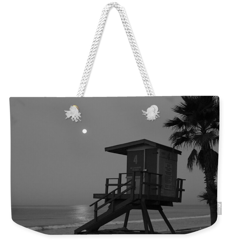 Moonrise Weekender Tote Bag featuring the photograph Black and White Moon Over Lifeguard Tower by Richard Cheski