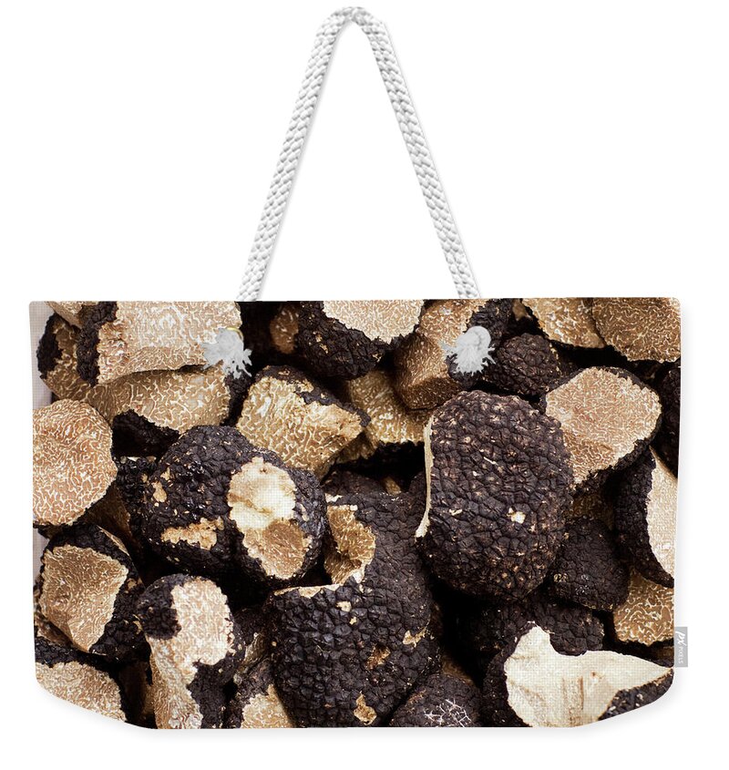 Gotland Weekender Tote Bag featuring the photograph Black Truffles On White Background by Johner Images